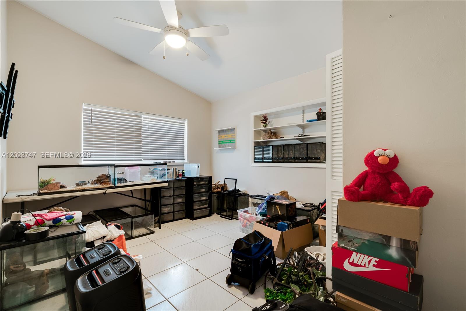 11515 Southwest 81st Road, Unit 11515 Pinecrest, FL 33156 - Photo 24 of 33 a room with furniture toys and a window