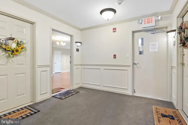 a kitchen with stainless steel appliances granite countertop white cabinets and a granite counter tops