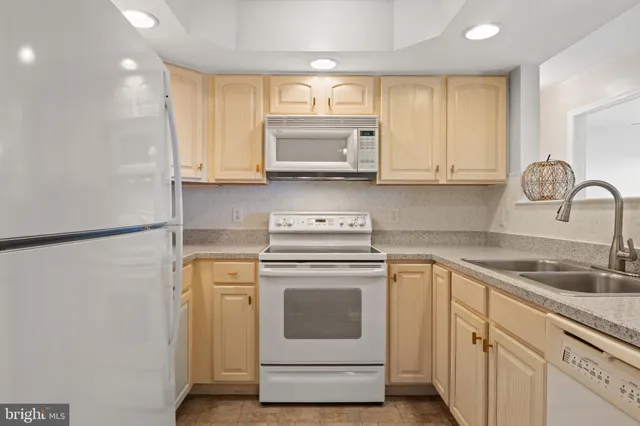a kitchen with sink and window