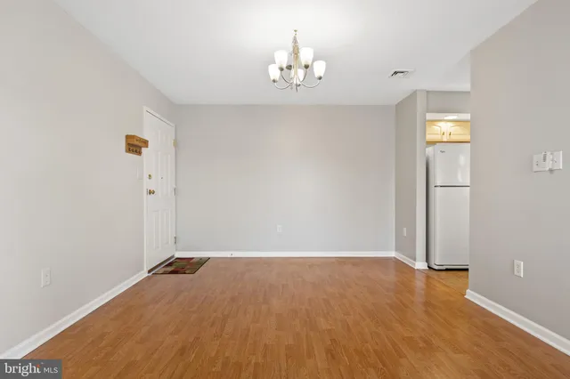 a view of a kitchen from the hallway