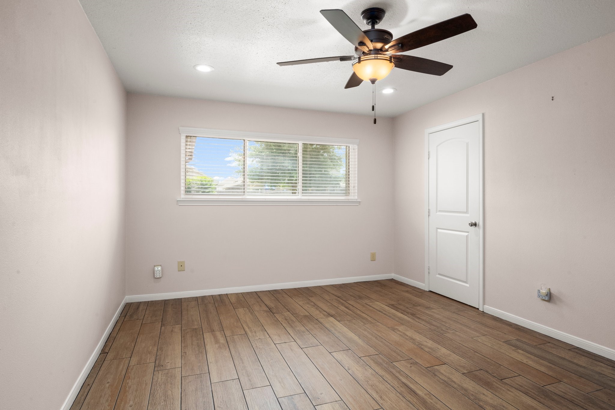 1206 Lynwood Road Spring, TX 77373 - Photo 19 of 29 wooden floor in an empty room with a window