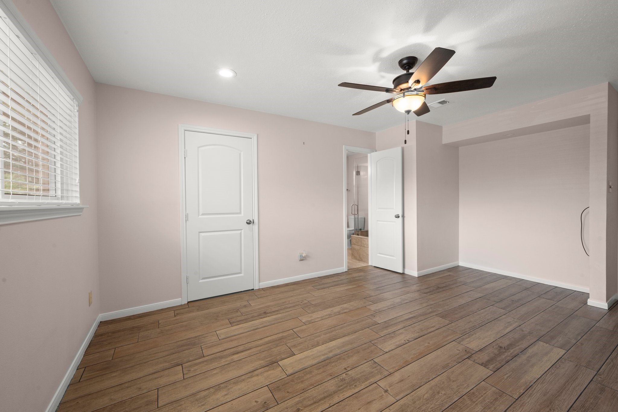 1206 Lynwood Road Spring, TX 77373 - Photo 20 of 29 a view of empty room with wooden floor and fan