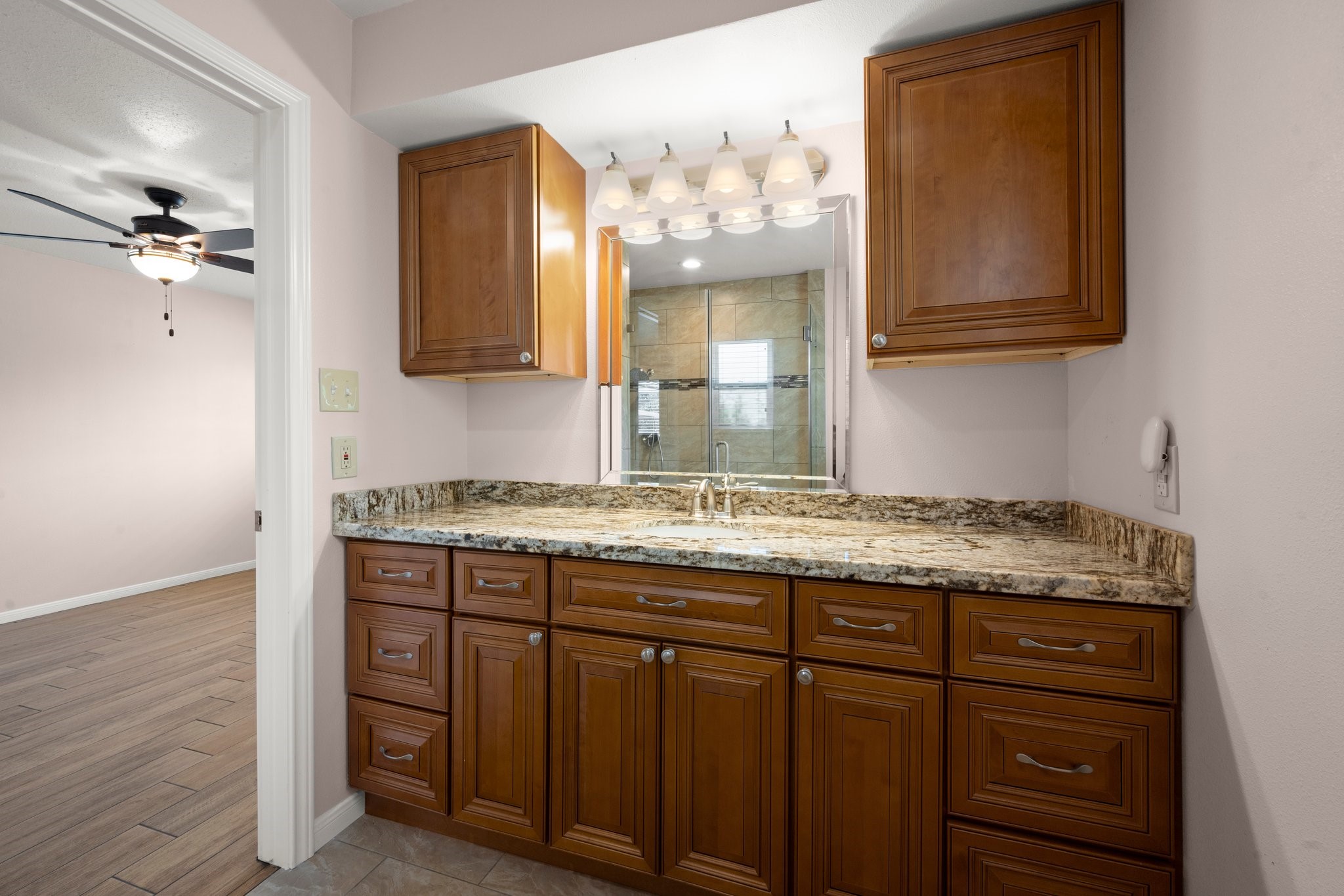 1206 Lynwood Road Spring, TX 77373 - Photo 21 of 29 a bathroom with a granite countertop sink and a mirror