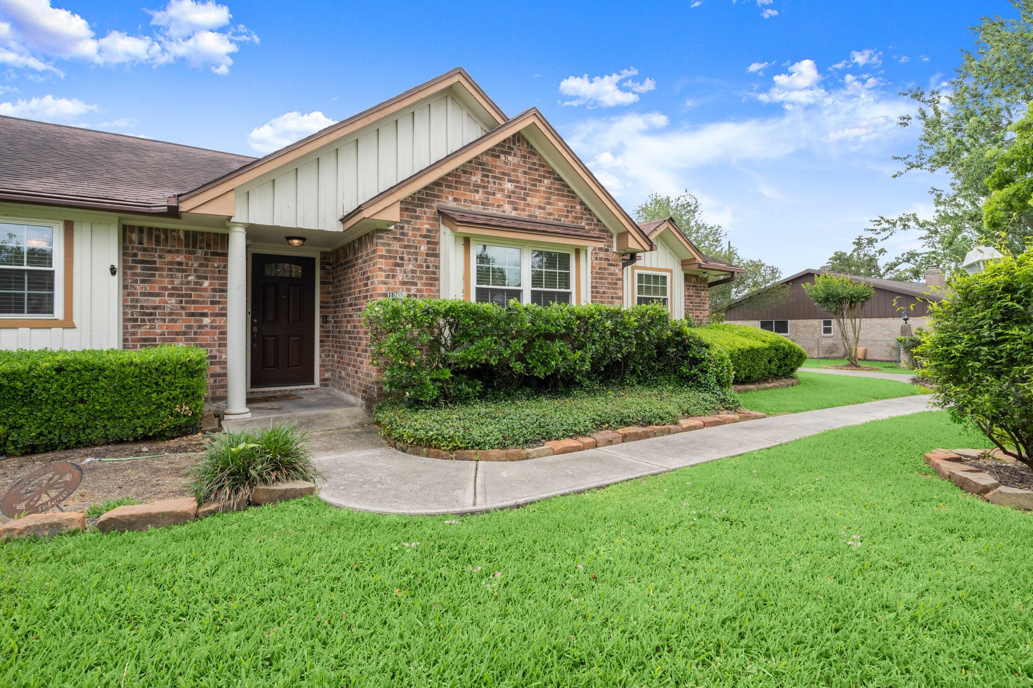 1206 Lynwood Road Spring, TX 77373 - Photo 4 of 29 a front view of a house with a yard