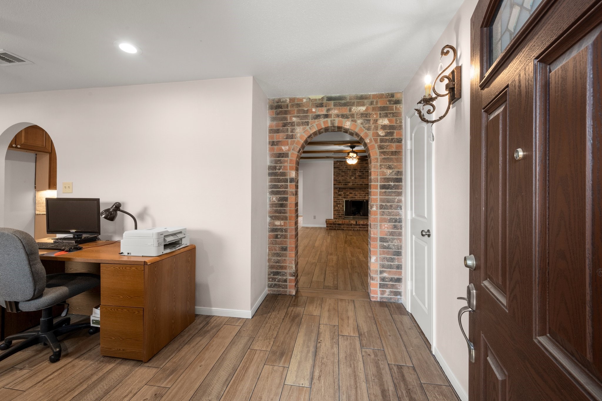 1206 Lynwood Road Spring, TX 77373 - Photo 5 of 29 a view of a workspace with wooden floor and furniture