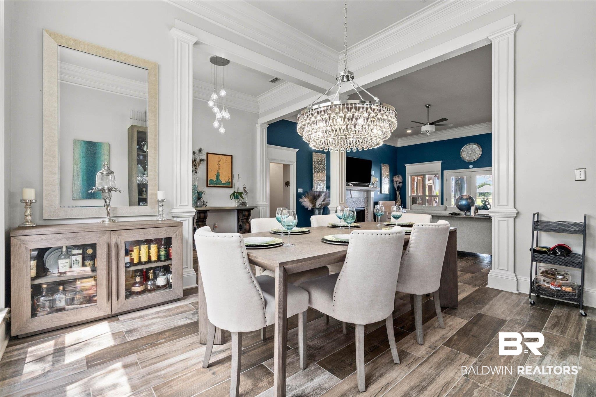 24908 Bosbyshell Avenue Daphne, AL 36526 - Photo 20 of 49 Formal dining area featuring a crystal chandelier and wood-finish tile flooring