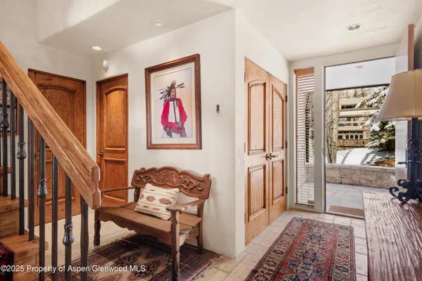 a living room with furniture and a rug