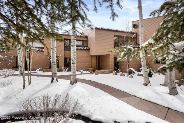 a view of a backyard with sitting area