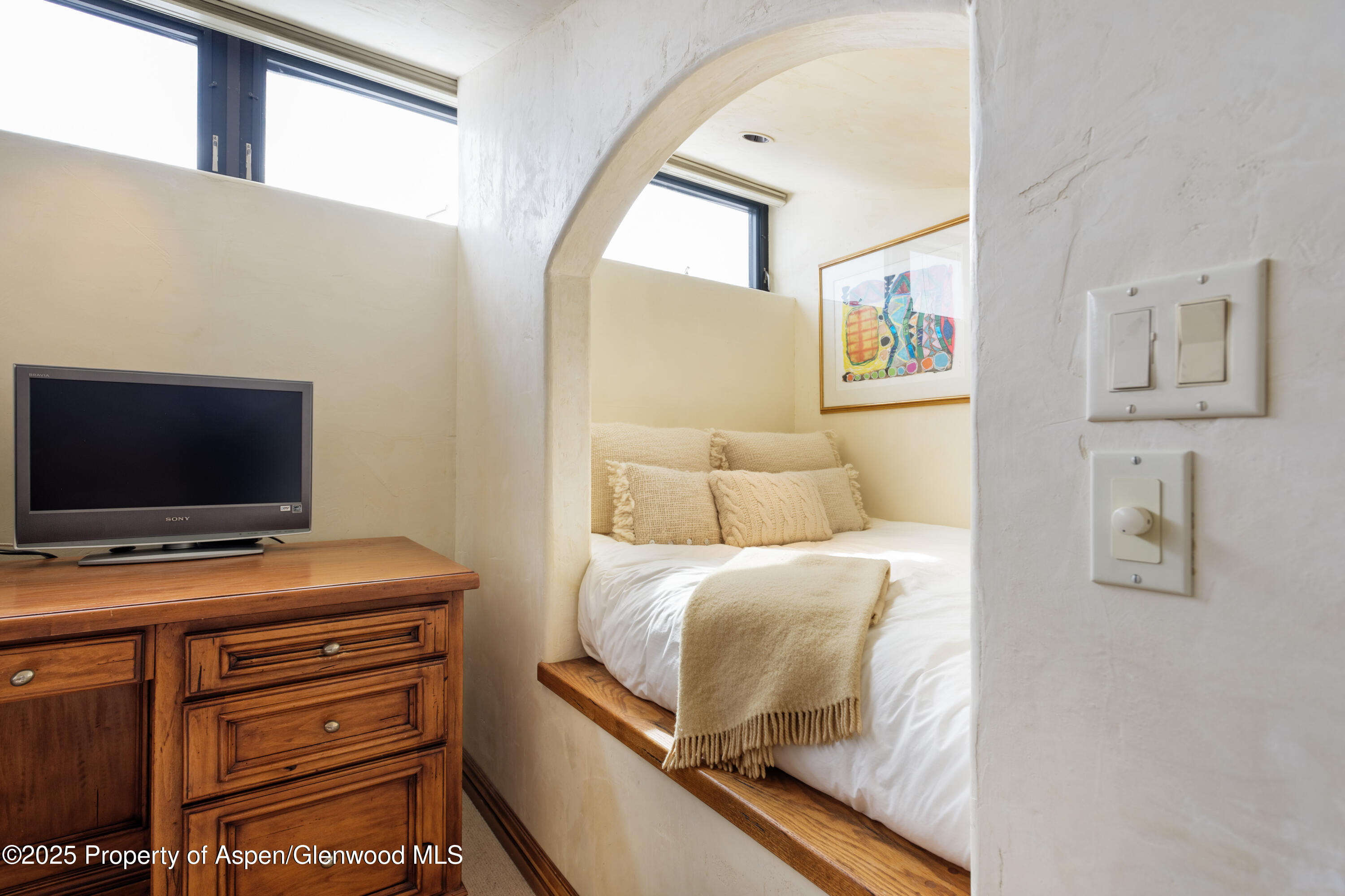 155 Lone Pine Road, Unit 5 Aspen, CO 81611 - Photo 26 of 26 a bedroom with a bed and a flat screen tv