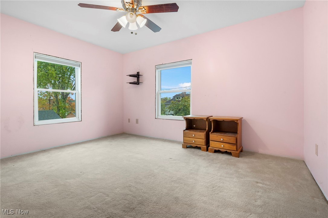 6453 Waterloo Road Atwater, OH 44201 - Photo 16 of 24 Empty room with carpet floors and a ceiling fan