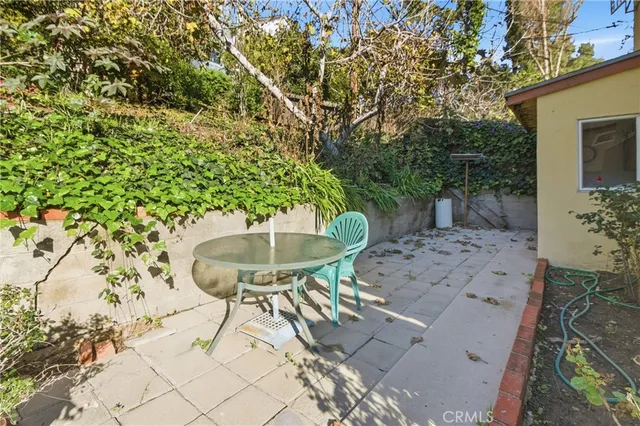 a view of a chairs and table in the patio