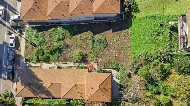 a view of a patio with table and chairs and potted plants