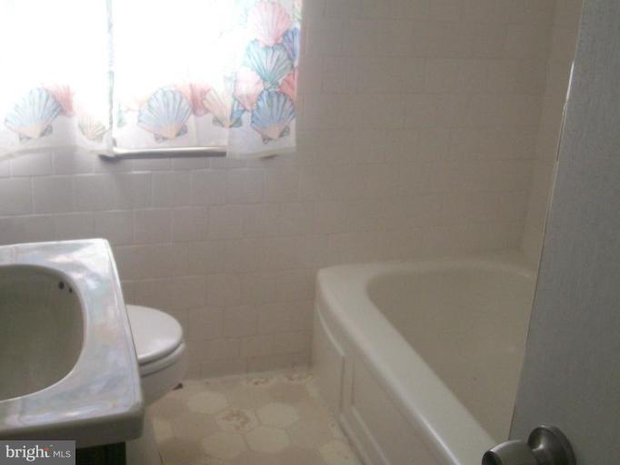 507 Brisbane Road Baltimore, MD 21229 - Photo 4 of 11 a bathroom with a sink and toilet