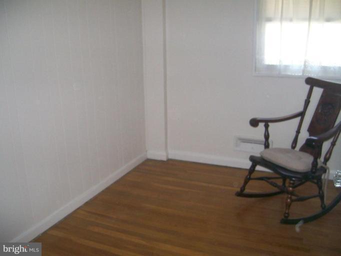 507 Brisbane Road Baltimore, MD 21229 - Photo 5 of 11 a view of a workspace with furniture and a window