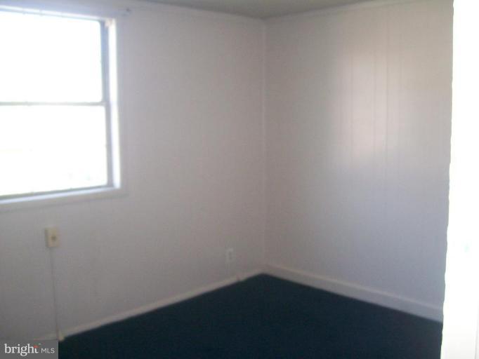507 Brisbane Road Baltimore, MD 21229 - Photo 6 of 11 a small space with a window