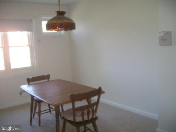 507 Brisbane Road Baltimore, MD 21229 - Photo 7 of 11 a view of a workspace with furniture and window