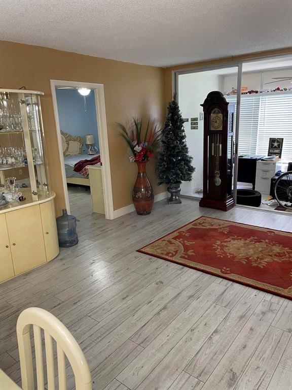 Tamarac Tamarac, FL 33319 - Photo 5 of 8 a living room with furniture and wooden floor
