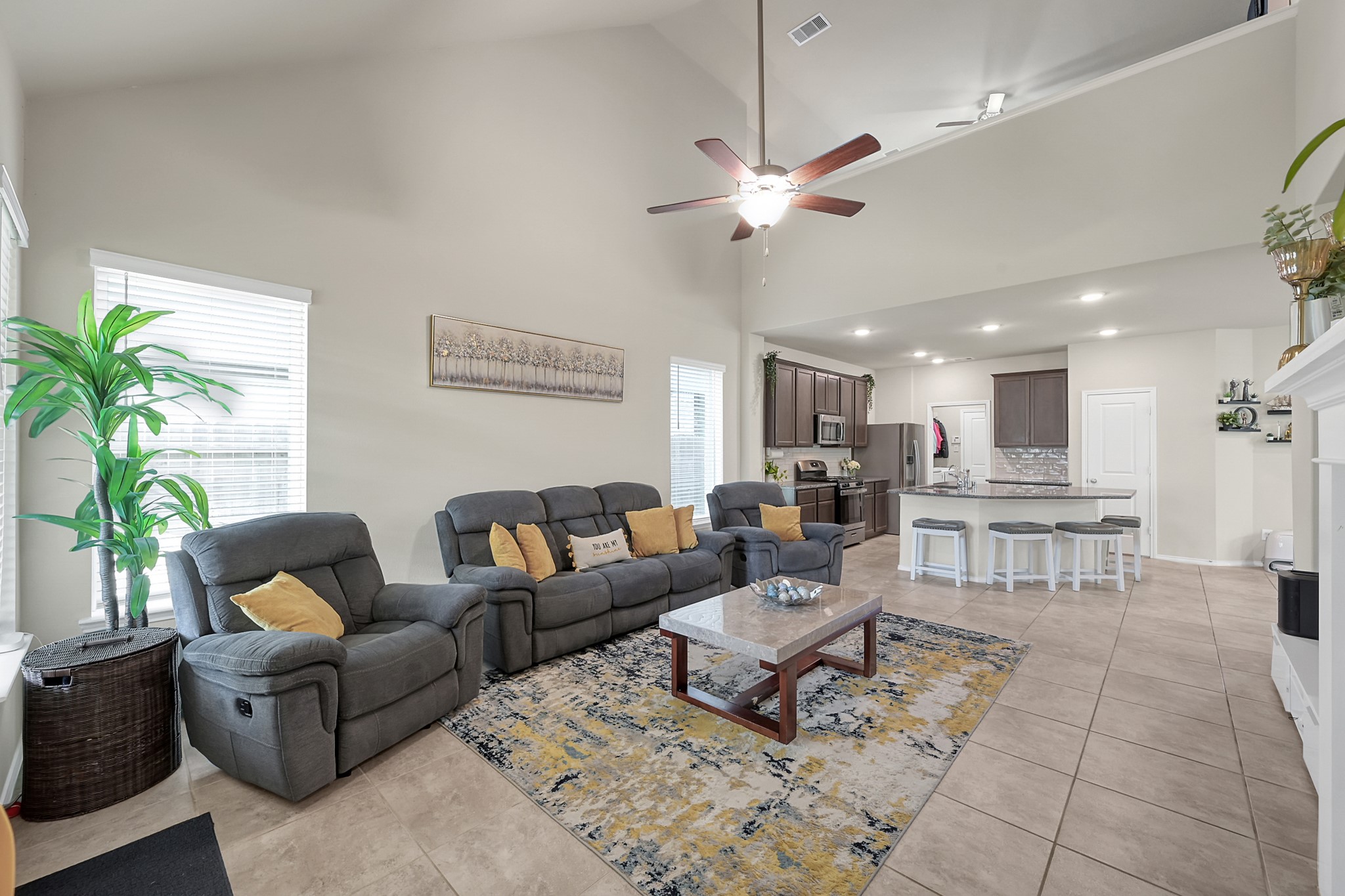 2811 Wilde Redbud Lane Conroe, TX 77385 - Photo 12 of 32 a living room with furniture potted plant and a window