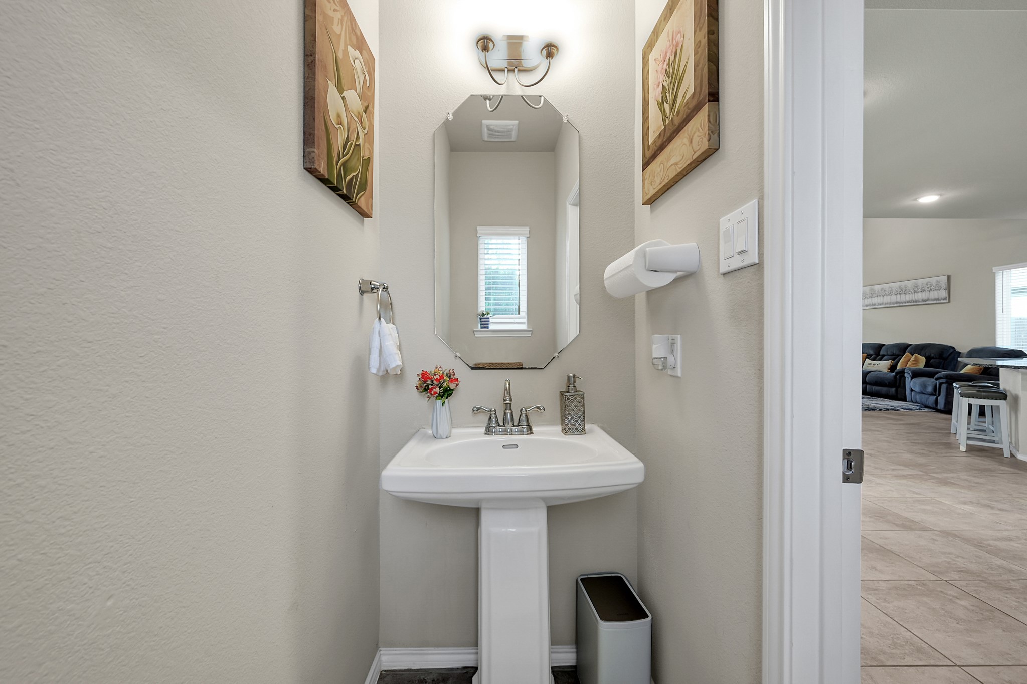 2811 Wilde Redbud Lane Conroe, TX 77385 - Photo 18 of 32 a bathroom with a sink a mirror and a window