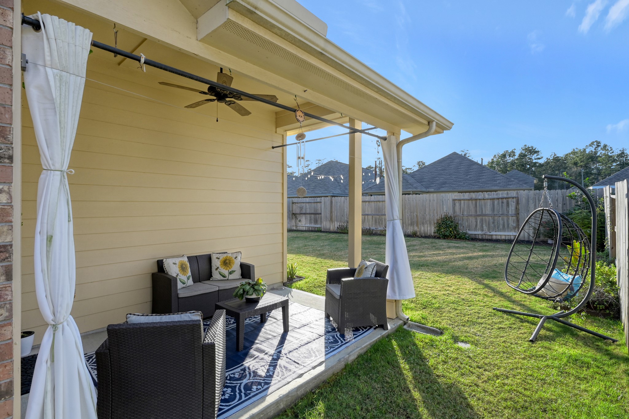 2811 Wilde Redbud Lane Conroe, TX 77385 - Photo 24 of 32 a view of a chair and tables in the backyard