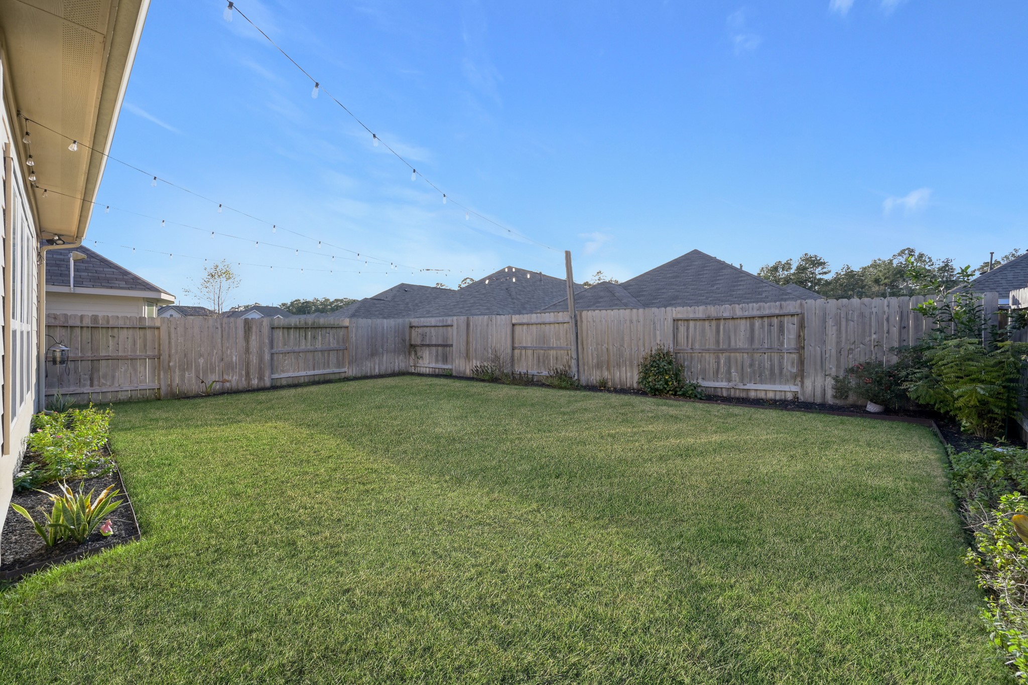 2811 Wilde Redbud Lane Conroe, TX 77385 - Photo 25 of 32 a view of a backyard with green space