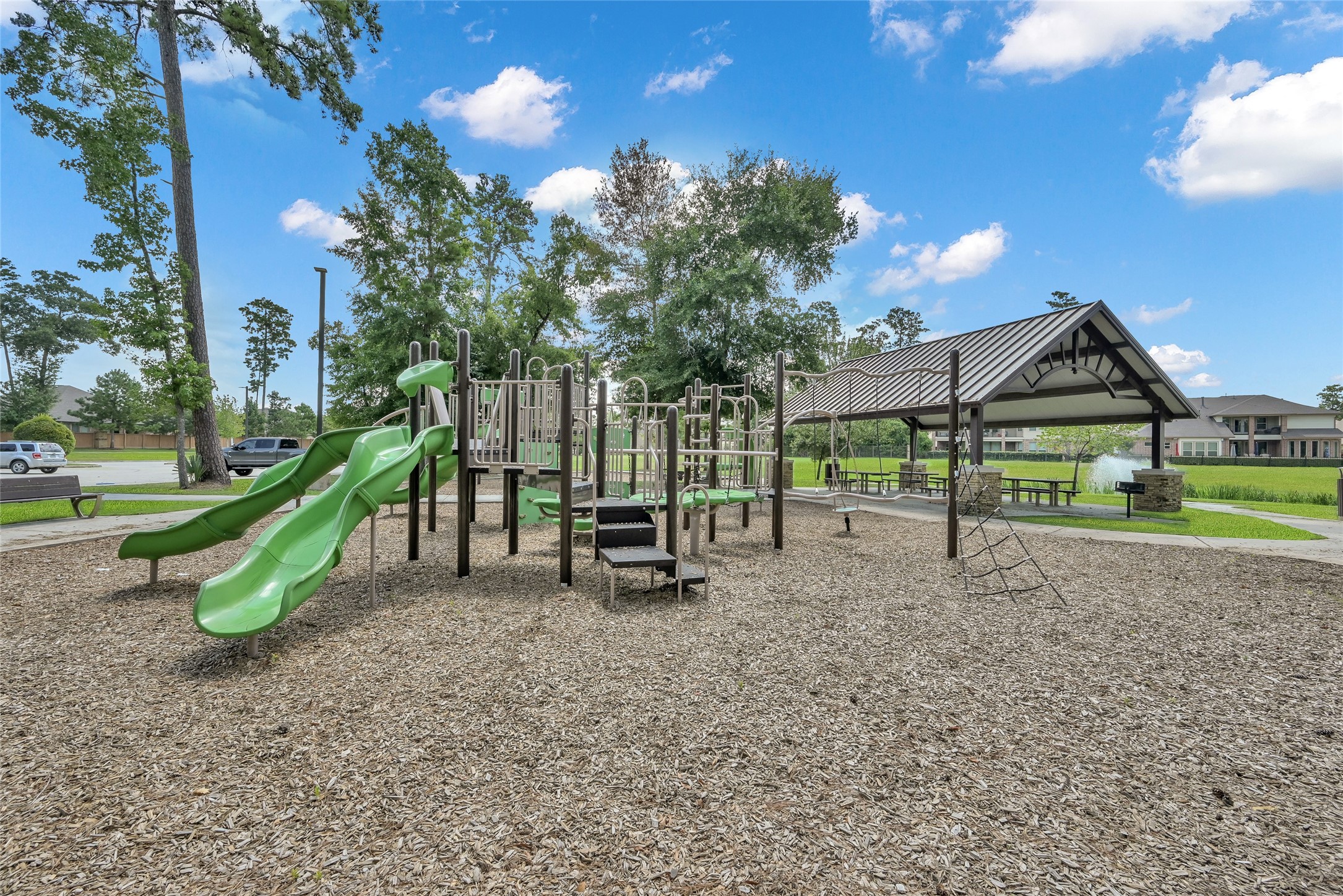 2811 Wilde Redbud Lane Conroe, TX 77385 - Photo 29 of 32 a view of a park with swings
