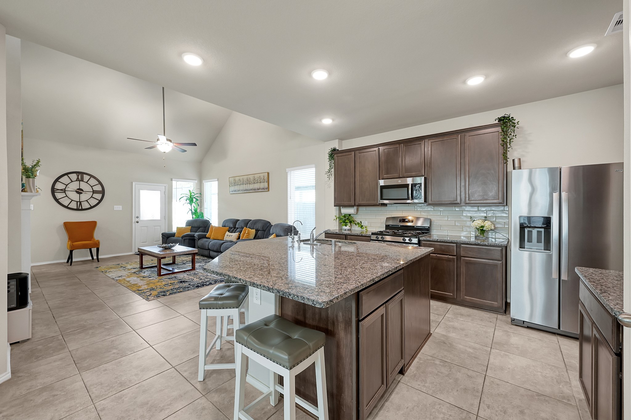 2811 Wilde Redbud Lane Conroe, TX 77385 - Photo 8 of 32 a kitchen with cabinets a counter space stainless steel appliances and a window