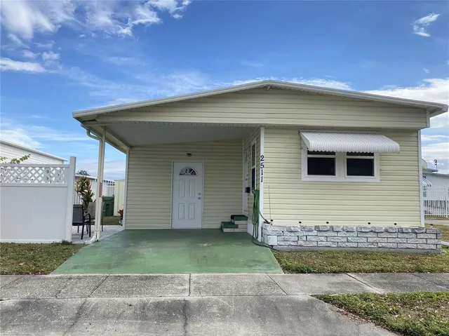 a view of a backyard with swimming pool
