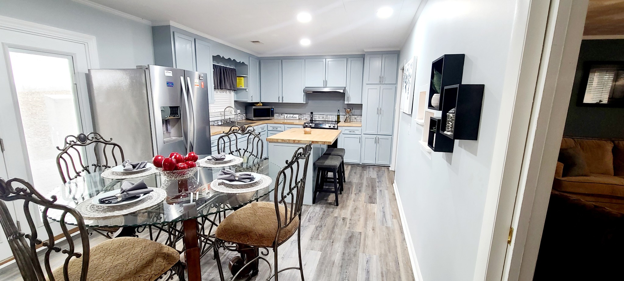 5323 Lanes Ferry Road Newbern, TN 38059 - Photo 13 of 31 a kitchen with stainless steel appliances a refrigerator stove microwave and cabinets