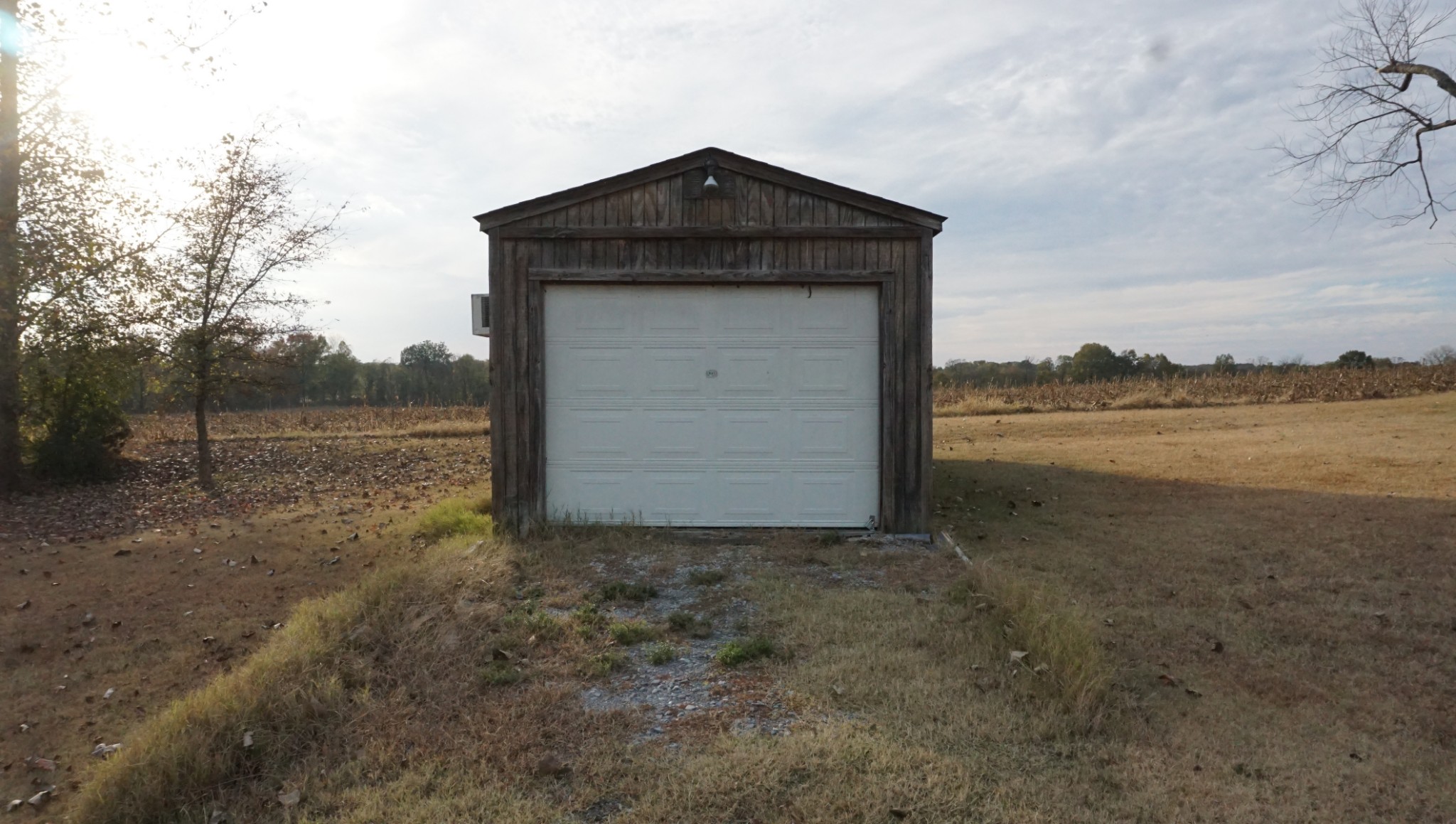 5323 Lanes Ferry Road Newbern, TN 38059 - Photo 6 of 31 a front view of a house with a yard and garage