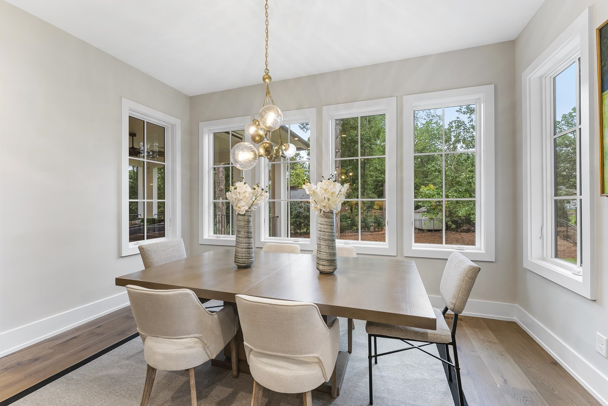 2312 Airline Drive Raleigh, NC 27607 - Photo 14 of 54 a dining room with furniture a chandelier and wooden floor