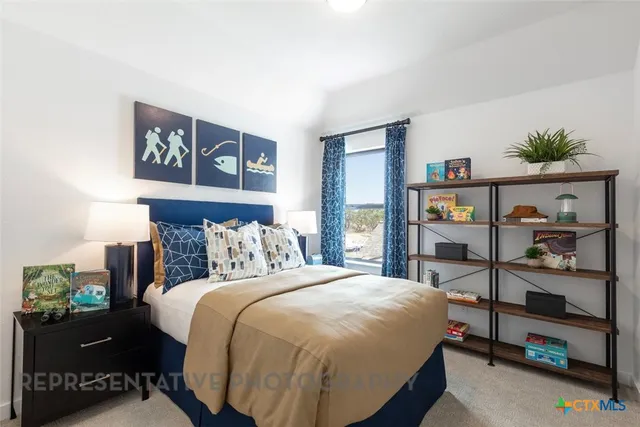 a bedroom with a bed and a book shelf