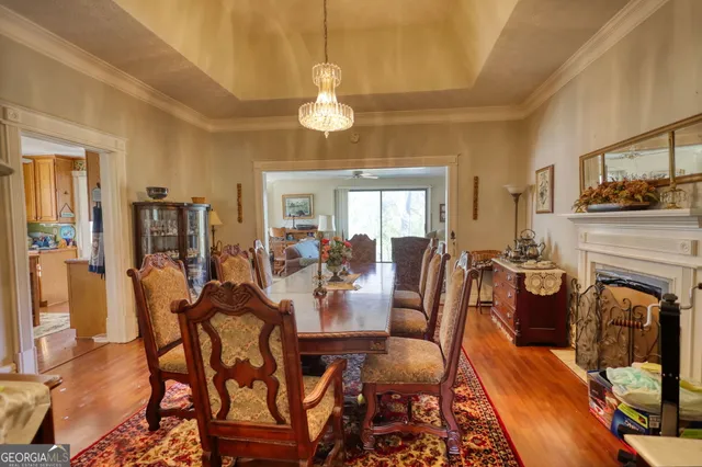 a living room with furniture and a mirror
