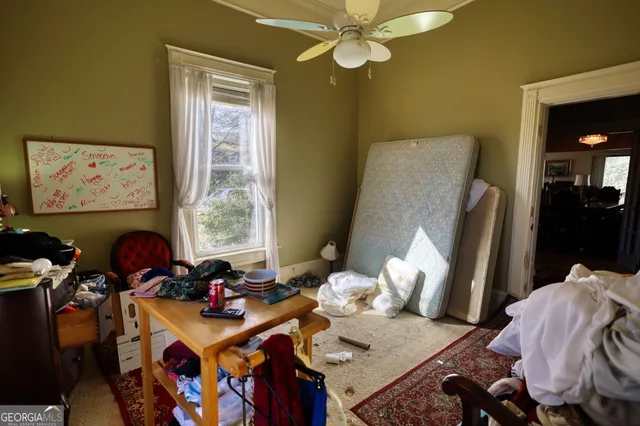 a bed room with furniture and a window