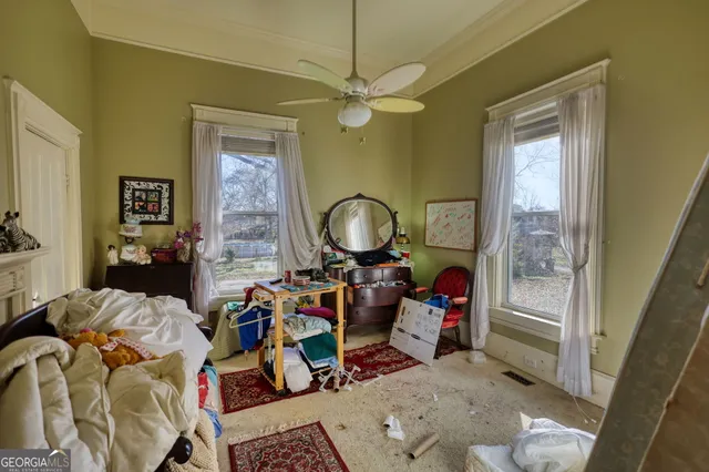 a living room with fireplace furniture and a window