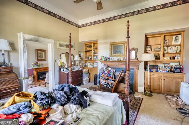 a room with furniture a rug and gym equipment