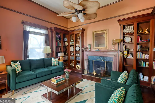 a view of a house with a yard covered in snow