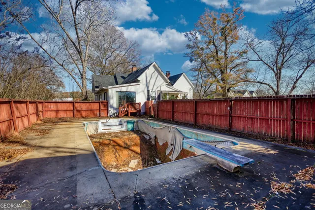 a view of swimming pool with a patio