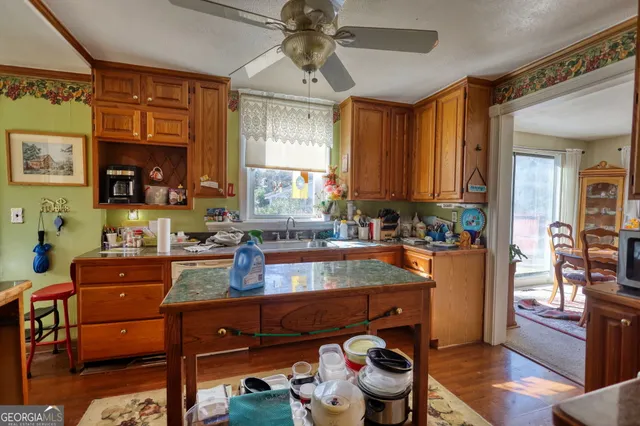 a living room with furniture a chandelier and a large window