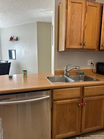 a close view of sink and cabinets
