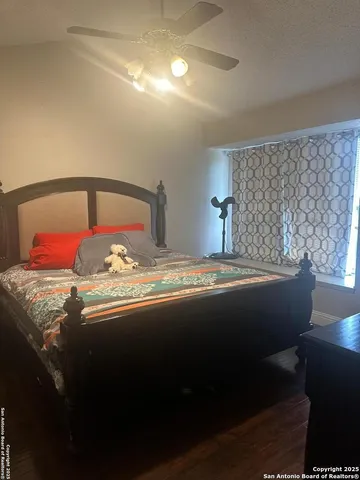 a bedroom with a bed and window