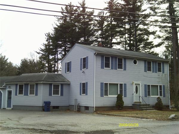 275 Andover Road Billerica, MA 01821 - Photo 1 of 26 a front view of a house with a yard