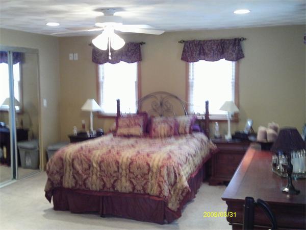 275 Andover Road Billerica, MA 01821 - Photo 13 of 26 a bedroom with a bed mirror and window