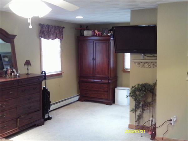 275 Andover Road Billerica, MA 01821 - Photo 14 of 26 a room with a dresser and a mirror