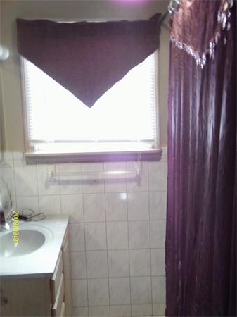 275 Andover Road Billerica, MA 01821 - Photo 16 of 26 a bathroom with a sink a vanity and a window