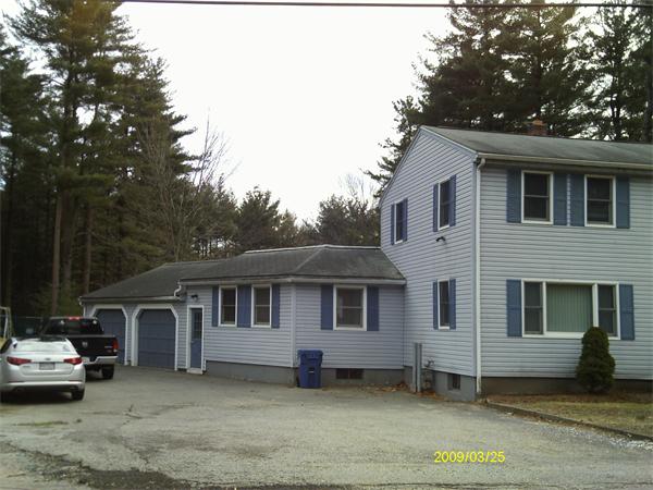 275 Andover Road Billerica, MA 01821 - Photo 2 of 26 a front view of a house with a yard