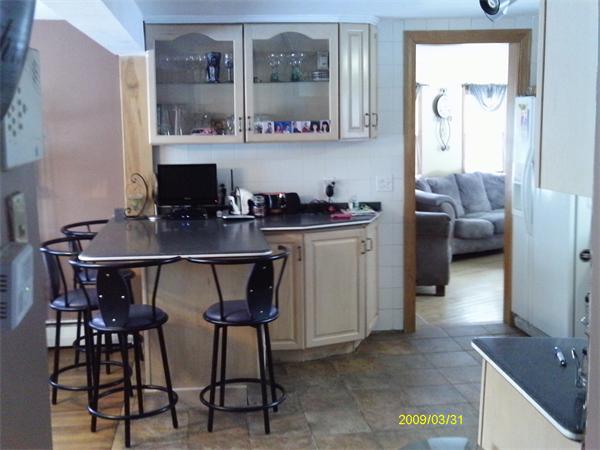 275 Andover Road Billerica, MA 01821 - Photo 4 of 26 a kitchen with a table and chairs