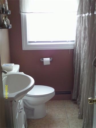 275 Andover Road Billerica, MA 01821 - Photo 7 of 26 a bathroom with a toilet and a sink