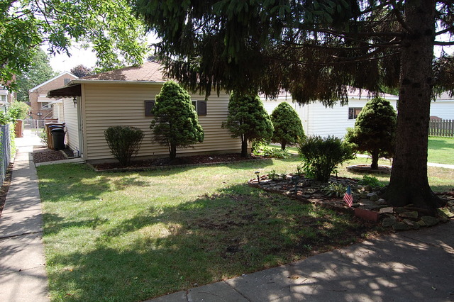 2227 Keystone Avenue North Riverside, IL 60546 - Photo 14 of 16 a view of a house with a tree in the yard