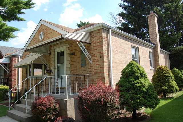 2227 Keystone Avenue North Riverside, IL 60546 - Photo 16 of 16 a view of a house with a small yard and potted plants